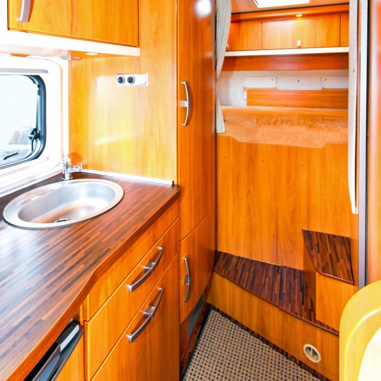 Interior of wooden kitchen in recreation vehicle